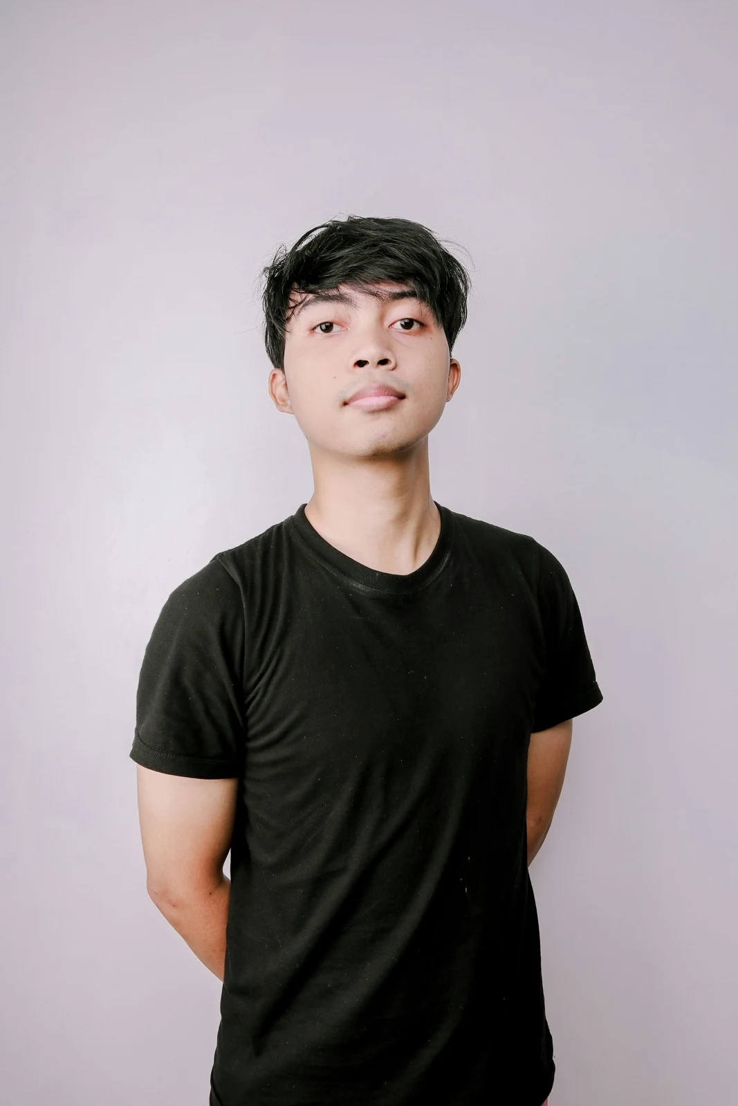 Man in a black crewneck T-shirt